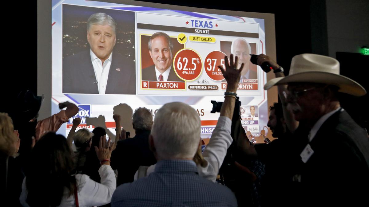 Supporters react to news of the returns at a watch party for Attorney General Ken Paxton held by the Lone Star Liberty PAC at the Dallas/Plano Marriott at Legacy Town Center on May 26, 2026 in Plano, Texas. Paxton defeated Sen. John Cornyn (R-TX) in a Senate primary runoff election and will face Democrat James Talarico in the November general election. (Stewart F. House/Getty Images/TNS)