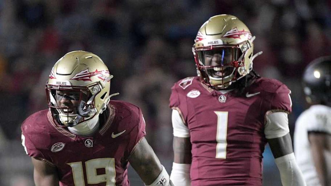  Nov 1, 2025; Tallahassee, Florida, USA; Florida State Seminoles defensive back Jerry Wilson (19) celebrates a big tackle with defensive back Shyheim Brown (1) during the second half at Doak S. Campbell Stadium. Mandatory Credit: Melina Myers-Imagn Images | Melina Myers-Imagn Images 