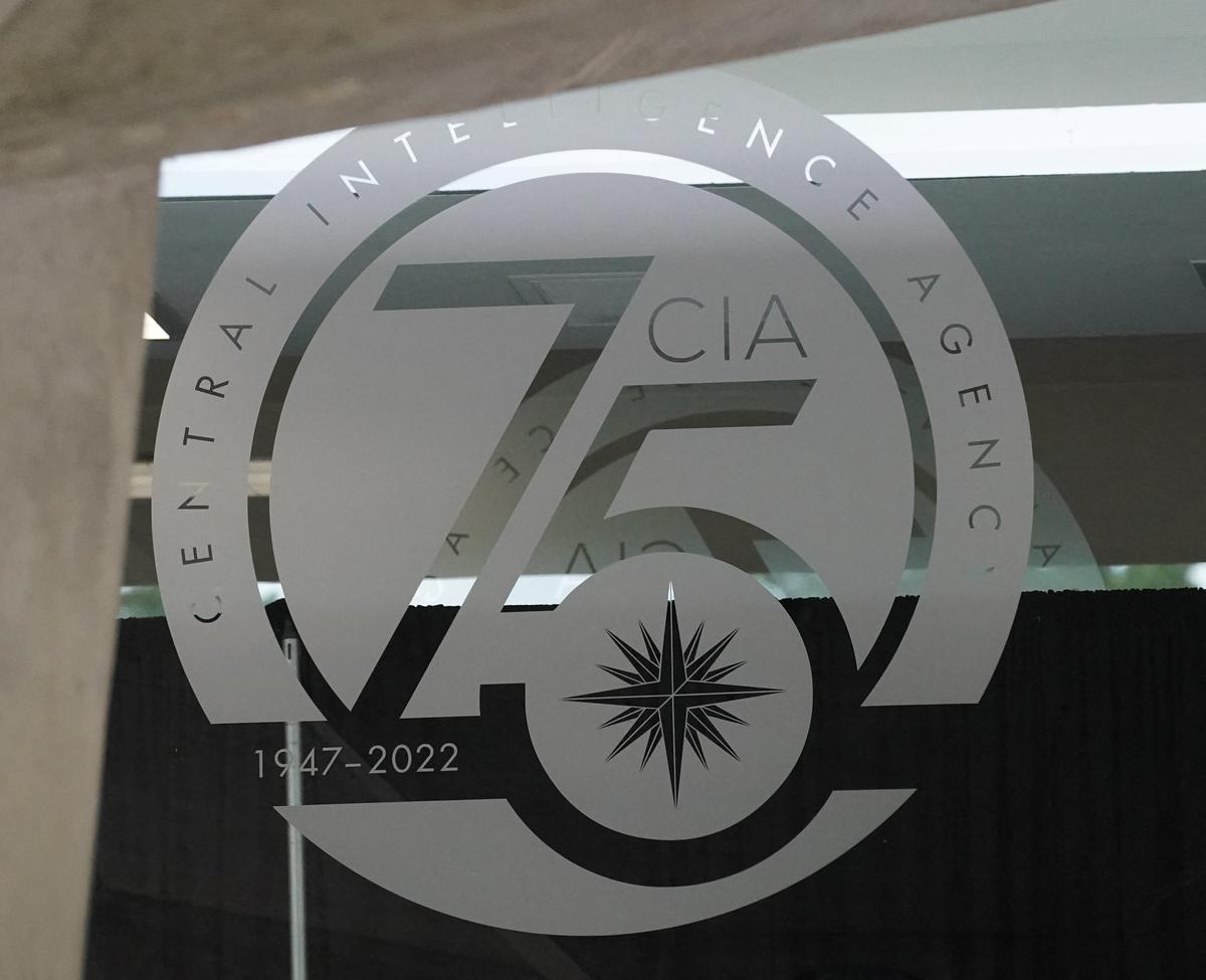 A glass door bears a commemorative seal marking 75 years at CIA headquarters in Langley, Virginia, U.S., July 8, 2022. REUTERS/Kevin Lamarque