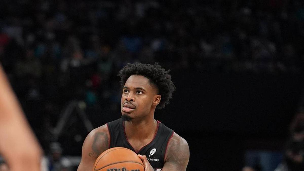  Apr 14, 2026; Charlotte, North Carolina, USA; Miami Heat guard Davion Mitchell (45) shoots the ball against the Charlotte Hornets during the second quarter during the play-in rounds between the Charlotte Hornets and the Miami Heat of the 2026 NBA Playoffs at Spectrum Center. Mandatory Credit: Jim Dedmon-Imagn Images | Jim Dedmon-Imagn Images 