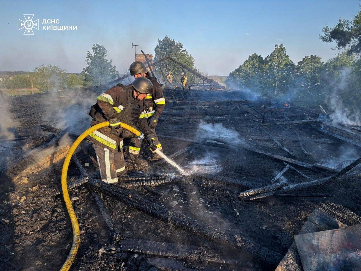 Firefighters work at the site of a kindergarten damaged during a Russian drone strike, amid Russia's attack on Ukraine, in Kyiv region, Ukraine May 12, 2026. Press service of the State Emergency Service of Ukraine in Kyiv region/Handout via REUTERS