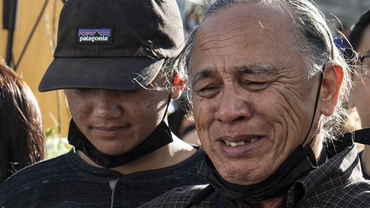 Father of Paul Megia (R) mourns at a memorial vigil for nine slain transit workers including Paul Megia in San Jose, Calif., on May 27, 2021. File Photo by Terry Schmitt/UPI