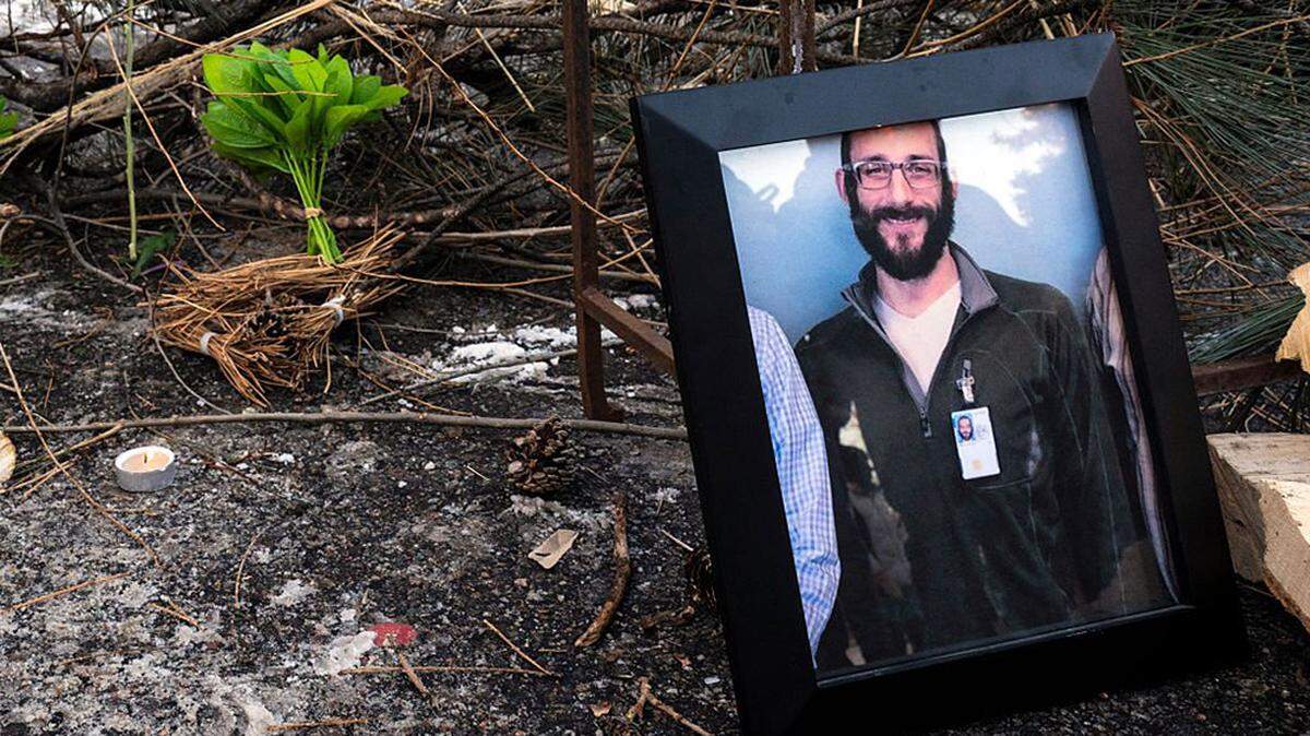 A photograph of 37-year-old Alex Pretti can be seen at a makeshift memorial in the area where he was shot dead by federal immigration agents in Minneapolis on Saturday. The second fatal shooting of a U.S. citizen during the Trump administration's unprecedented operation in the city sparked fresh protests and outrage from state officials.