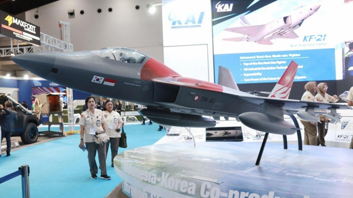 Visitors look at a mock-up of the South Korean-made KF-21 Boramae jet fighter during the Indo Defense 2025 exhibition in Jakarta, Indonesia. Photo by ADI WEDA / EPA