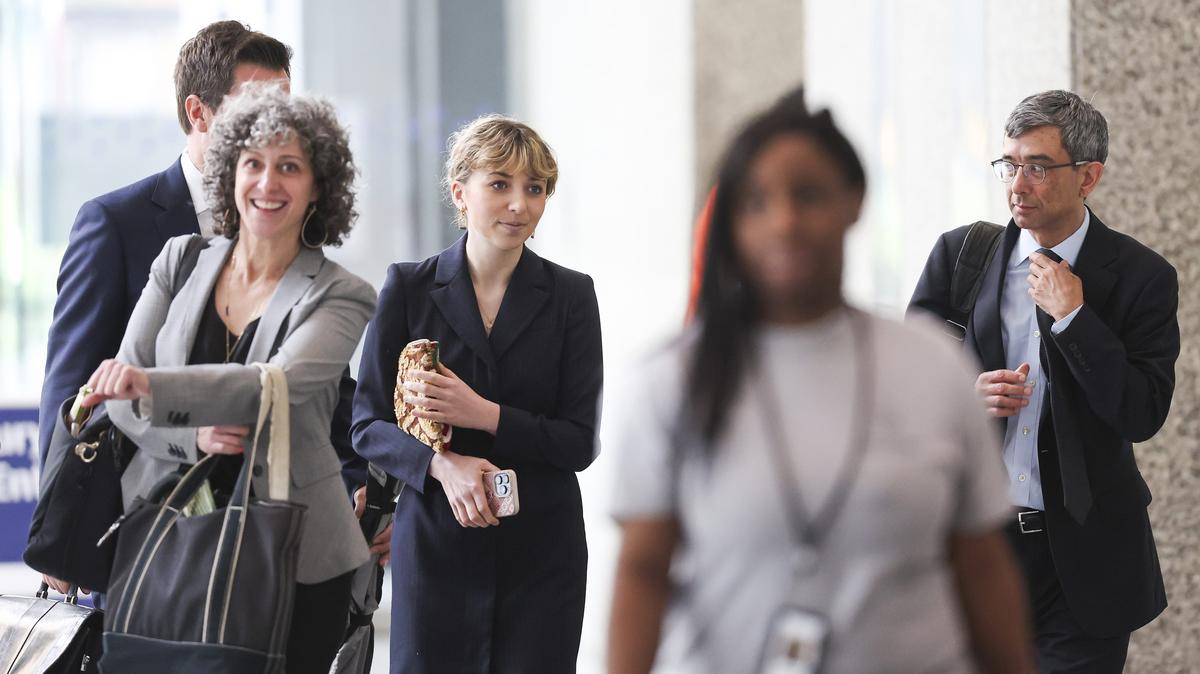 Kat Abughazaleh, second from left, leaves the Dirksen U.S. Courthouse after a pretrial conference on Monday, May 18, 2026, in Chicago. (Eileen T. Meslar/Chicago Tribune/TNS)