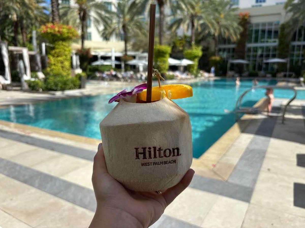  Tropical coconut water beverage poolside at  Hilton  West Palm Beach. Photo credit: Emily Caldwell 