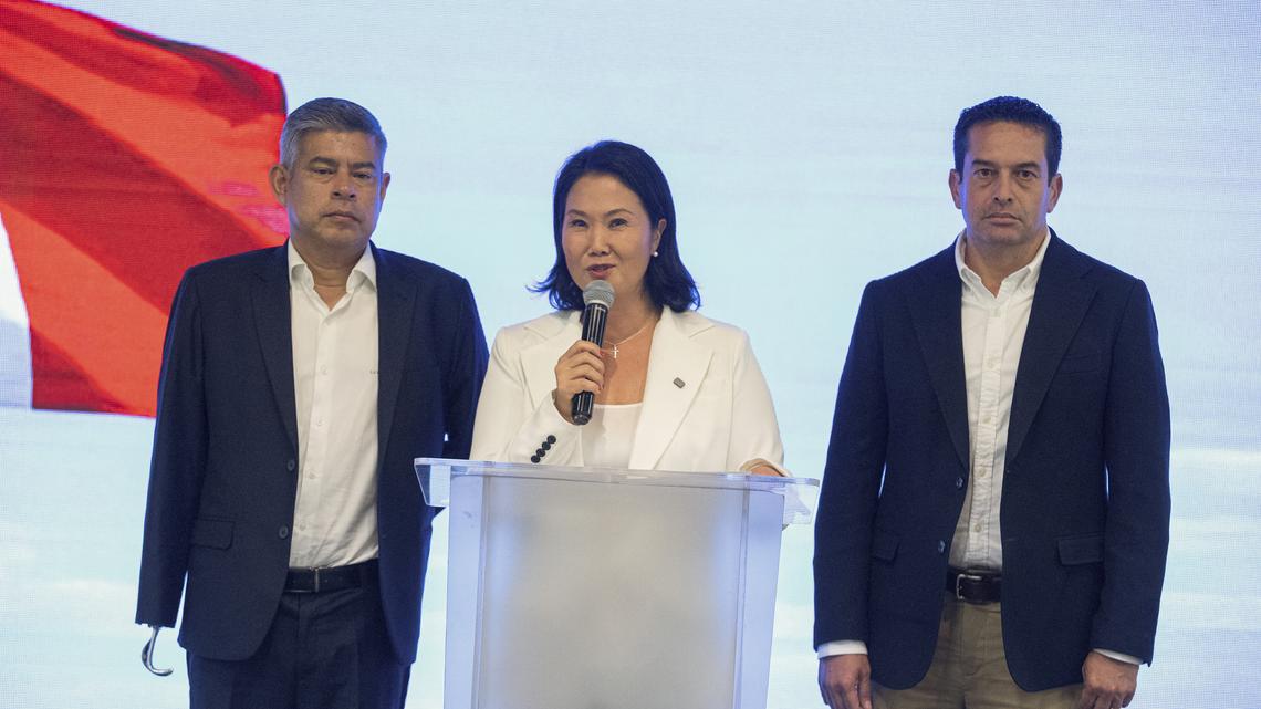 Peru's presidential candidate for the Fuerza Popular party, Keiko Fujimori, speaks during a press conference next to Luis Galarreta Velarde, left, as candidate for first vice president and Miki Torres Morales, right, as candidate for second vice president following the first results of the presidential election in Lima on April 13, 2026. Right-wing candidate Keiko Fujimori led exit polls following Peru's troubled presidential election on April 12, 2026, but failed to avoid a runoff after a tight vote marred by irregularities and a police raid on the country's election authority. (AFP via Getty Images/TNS)