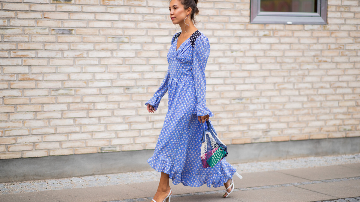COPENHAGEN, DENMARK - AUGUST 08: A guest wearing blue dress, net bag is seen outside Stine Goya during the Copenhagen Fashion Week Spring/Summer 2019 on August 8, 2018 in Copenhagen, Denmark. (Photo by Christian Vierig/Getty Images)