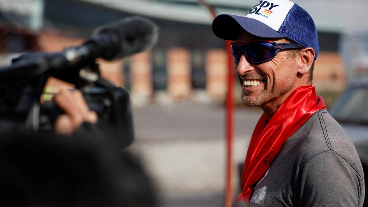 British climber Kenton Cool, 49, smiles while he speaks with the media personnel, upon his arrival at the airport, as he returns after completing his 17th ascent of Mount Everest, which is the most by any foreign climber, in Kathmandu, Nepal May 19, 2023. REUTERS/Navesh Chitrakar