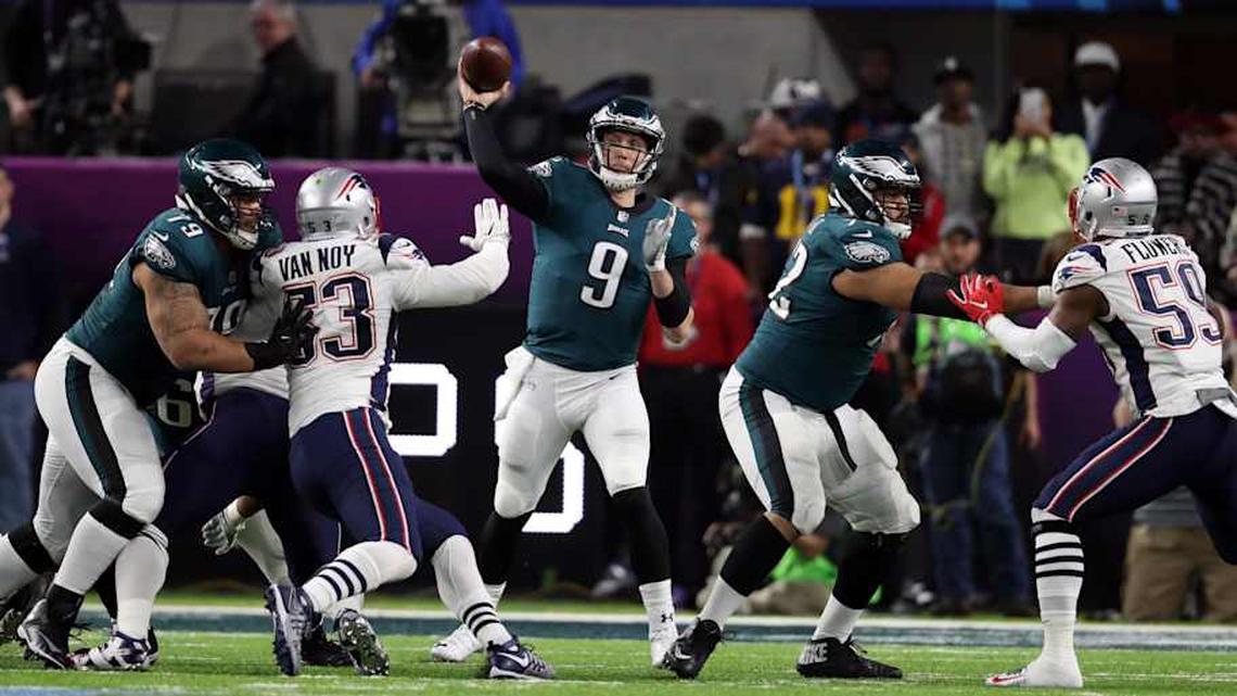 Feb 4, 2018; Minneapolis, MN, USA; Philadelphia Eagles quarterback Nick Foles (9) throws the ball under pressure by New England Patriots outside linebacker Kyle Van Noy (53) during the third quarter in Super Bowl LII at U.S. Bank Stadium. Mandatory Credit: Matthew Emmons-Imagn Images. 