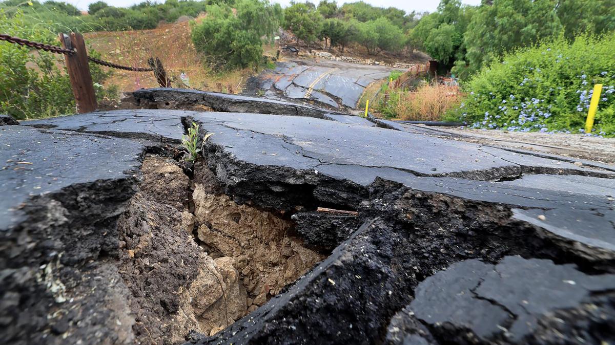 A road is damaged adjacent to Corinne Gerrard's property and home amidst the latest damage in the landslide movement in the Portuguese Bend area of Rancho Palos Verdes Wednesday, June 4, 2025. (Allen J. Schaben/Los Angeles Times/TNS)