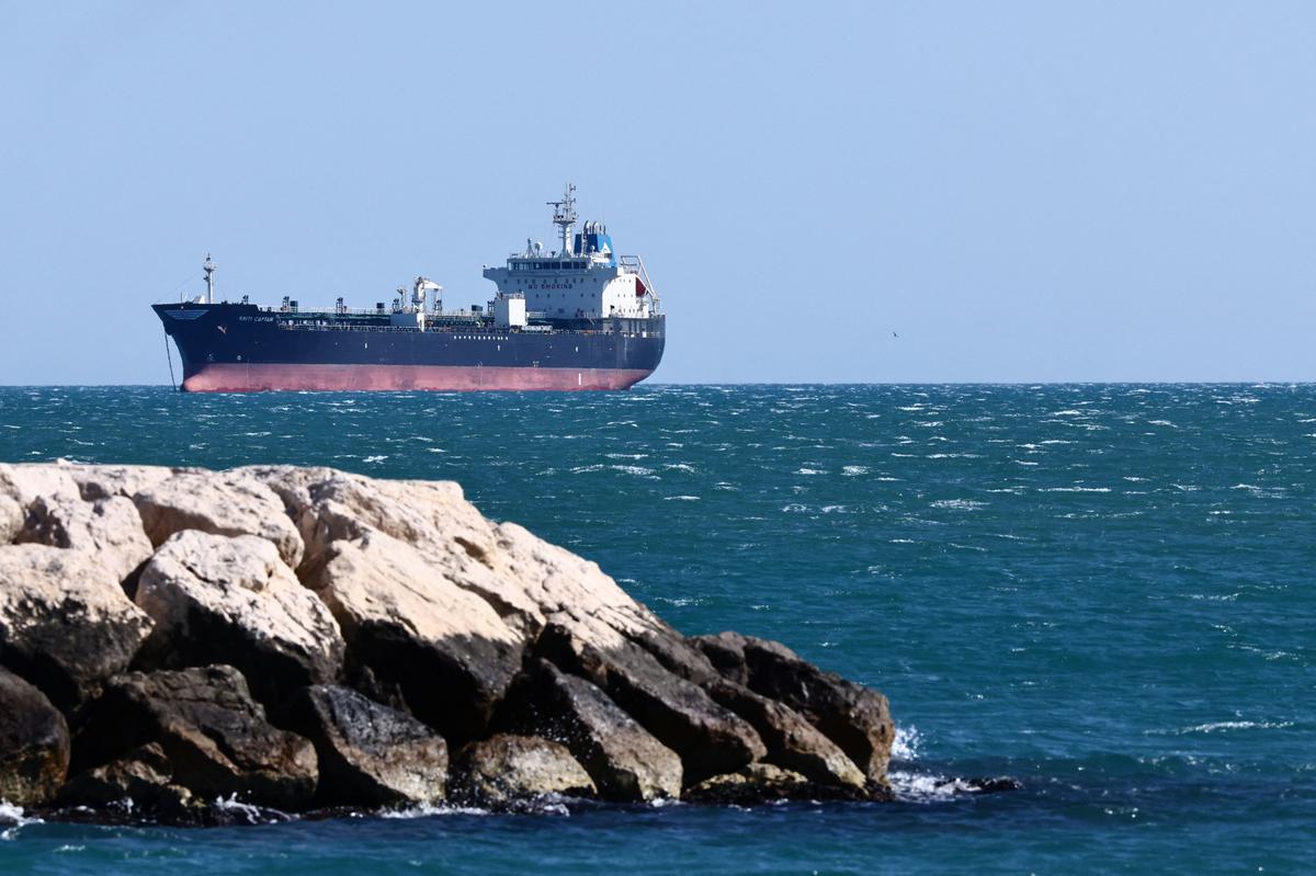 An oil tanker anchors near the oil hub of the port of Fos-Lavera at sunset near Marseille, southern France, April 14, 2026. REUTERS/Manon Cruz