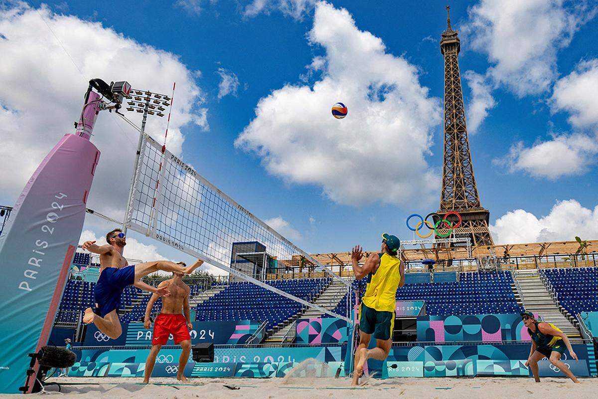From left, Norwegian players Christian Sorum and Anders Mol and Australian players Thomas Hodges and Zachery Schubert take part in a practice session ahead of the opening of the 2024 Olympic Games at the Eiffel Tower Stadium in Paris on Wednesday.