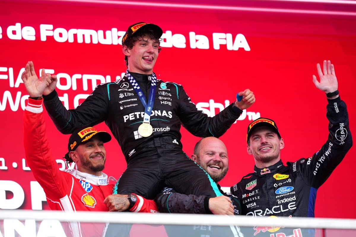  Kimi Antonelli, Lewis Hamilton, Max Verstappen, and Dean Hale, Senior Race Team Composite Technician at Mercedes AMG Petronas F1 Team, celebrate on the podium during the 2026 F1 Canadian Grand Prix. Photo by Sona Maleterova/Getty Images