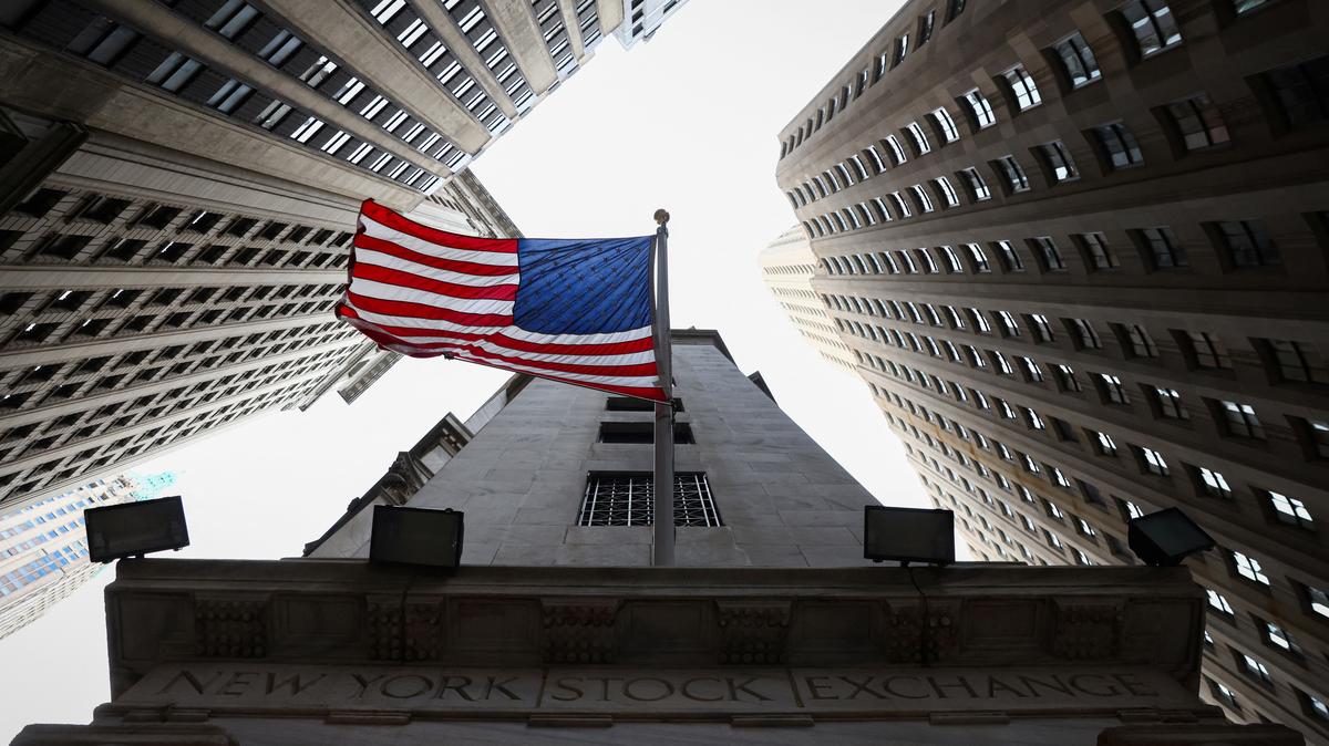 A U.S. flag is seen outside the New York Stock Exchange (NYSE) in New York City, U.S., January 26, 2023. REUTERS/Andrew Kelly