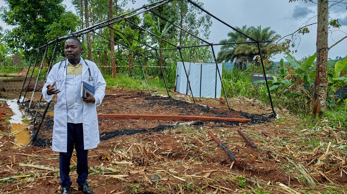 Mungwalu General Hospital Medical Director Richard Lokudu speaks to Reuters next to the burned remains of a destroyed Doctors Without Borders emergency isolation tent at the facility as aid agencies intensify efforts to contain an Ebola outbreak in Mongbwalu, Djugu Territory of Ituri province, Democratic Republic of Congo, on Saturday.