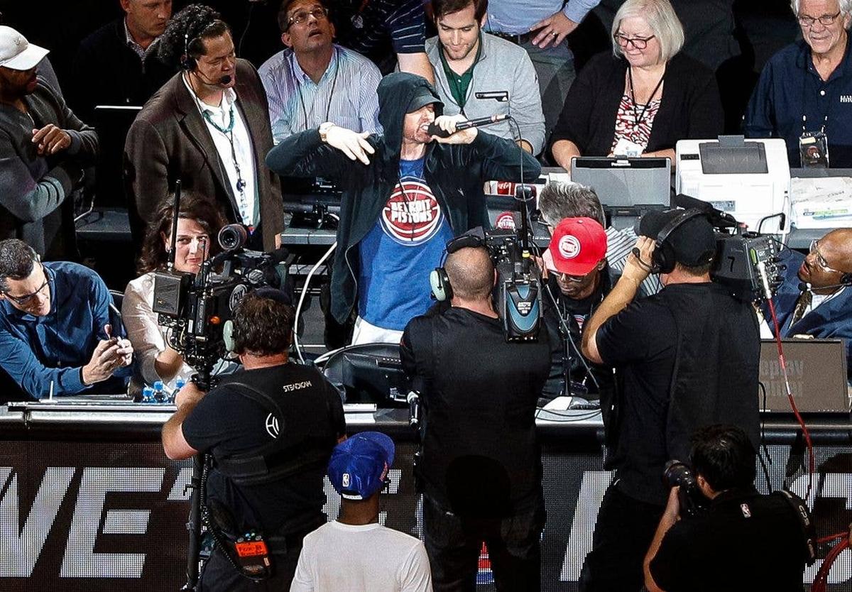  Eminem cheers the crowd before tipoff at Detroit Pistons' home opener at the Little Caesars Arena in 2018. USA TODAY Network via Reuters Connect