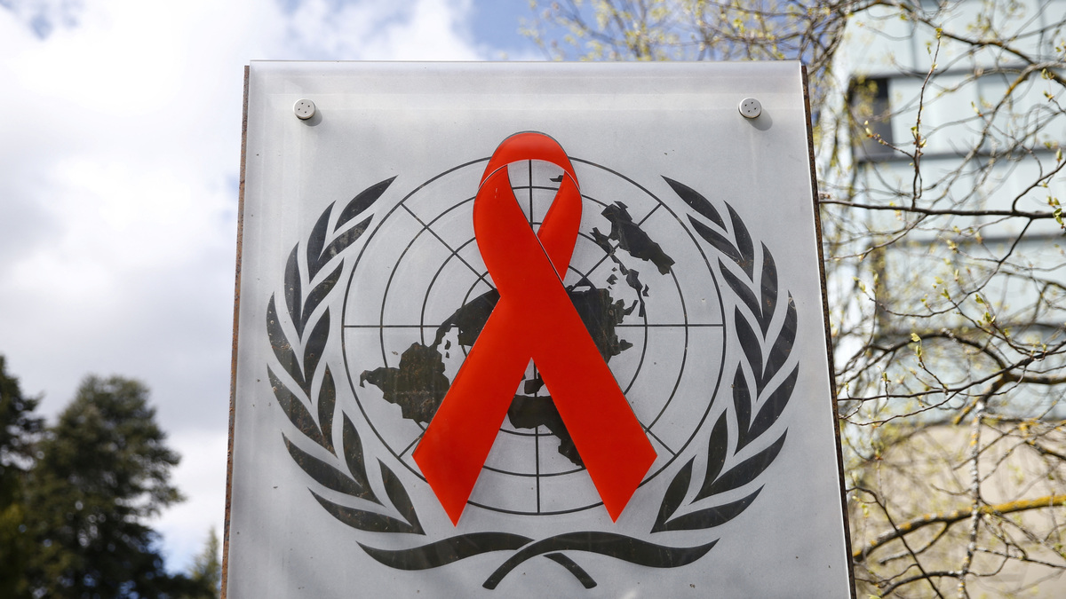 A logo is pictured outside a building of the United Nations AIDS agency (UNAIDS) in Geneva, Switzerland, April 6, 2021. Picture taken April 6, 2021. REUTERS/Denis Balibouse