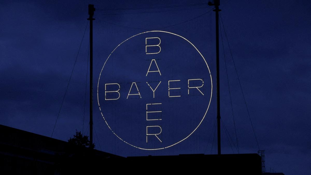 FILE PHOTO: The 120 metres high Bayer Cross, logo of German pharmaceutical and chemical maker Bayer AG, consisting of 1710 LED glass bulbs is seen outside the industrial park "Chempark" of the chemical industry in Leverkusen, Germany, September 23, 2023. REUTERS/Wolfgang Rattay/File Photo