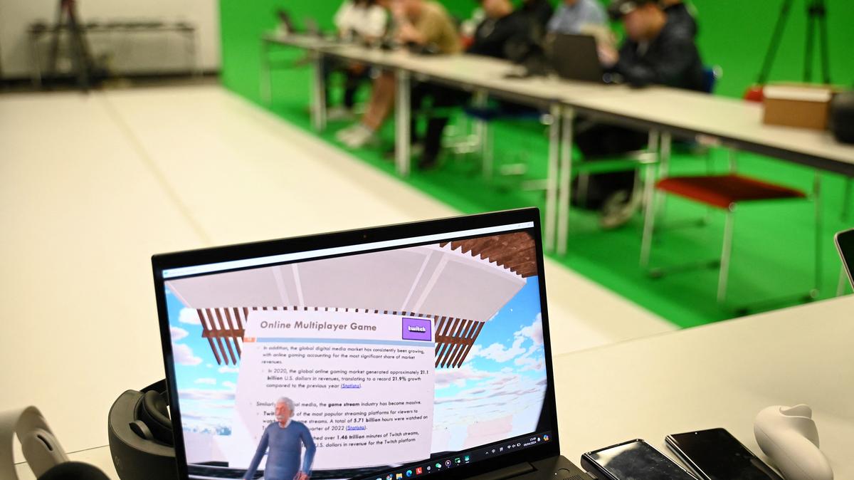 This photo taken on April 9, 2024, of a laptop screen showing the first-person view of a virtual reality headset worn by a student in class at the Hong Kong University of Science and Technology (HKUST), in Hong Kong. Slipping on headsets, students at a Hong Kong university were transported to a pavilion above the clouds to hear Albert Einstein expound on game theory -- part of a course deploying "AI lecturers" in the classroom. (Peter Parks/AFP/Getty Images/TNS)