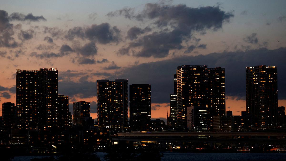 High-rise apartment buildings and high-rise office buildings are seen along Tokyo Bay waterfront area at dusk in Tokyo, Japan November 30, 2023.  REUTERS/Issei Kato
