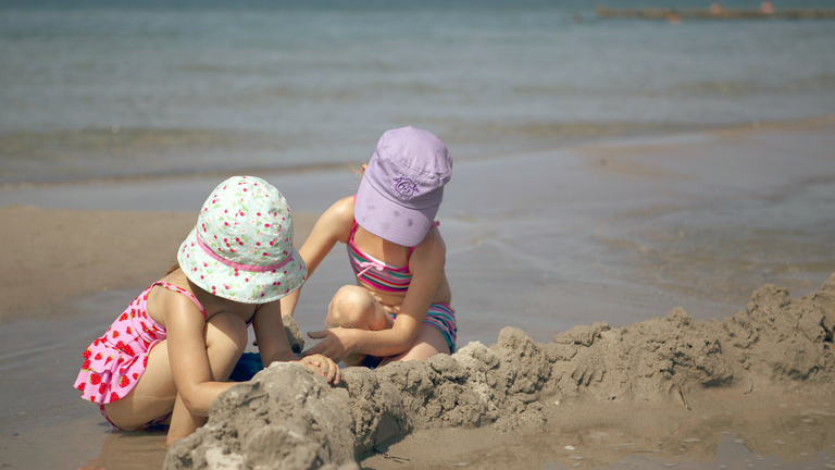 What are the long-term risks of a child getting sunburn?