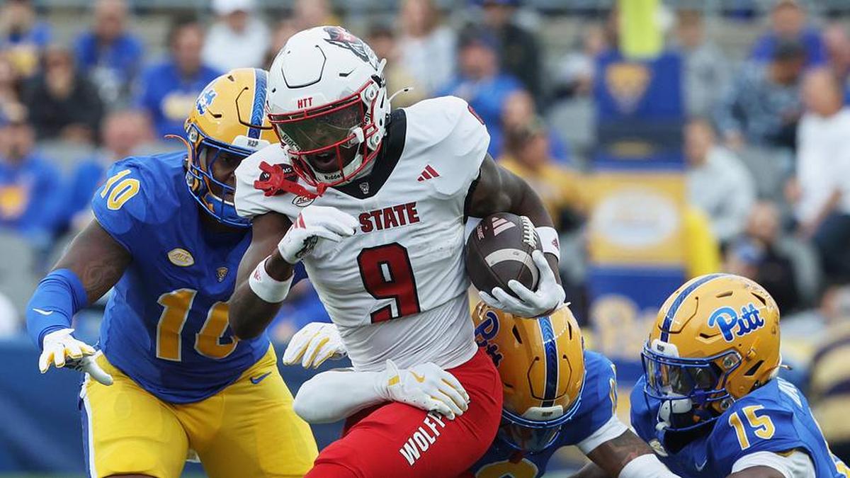  Oct 25, 2025; Pittsburgh, Pennsylvania, USA; North Carolina State Wolfpack wide receiver Terrell Anderson (9) runs with the ball after a catch against the Pittsburgh Panthers during the first quarter at Acrisure Stadium. Mandatory Credit: Charles LeClaire-Imagn Images | Charles LeClaire-Imagn Images 