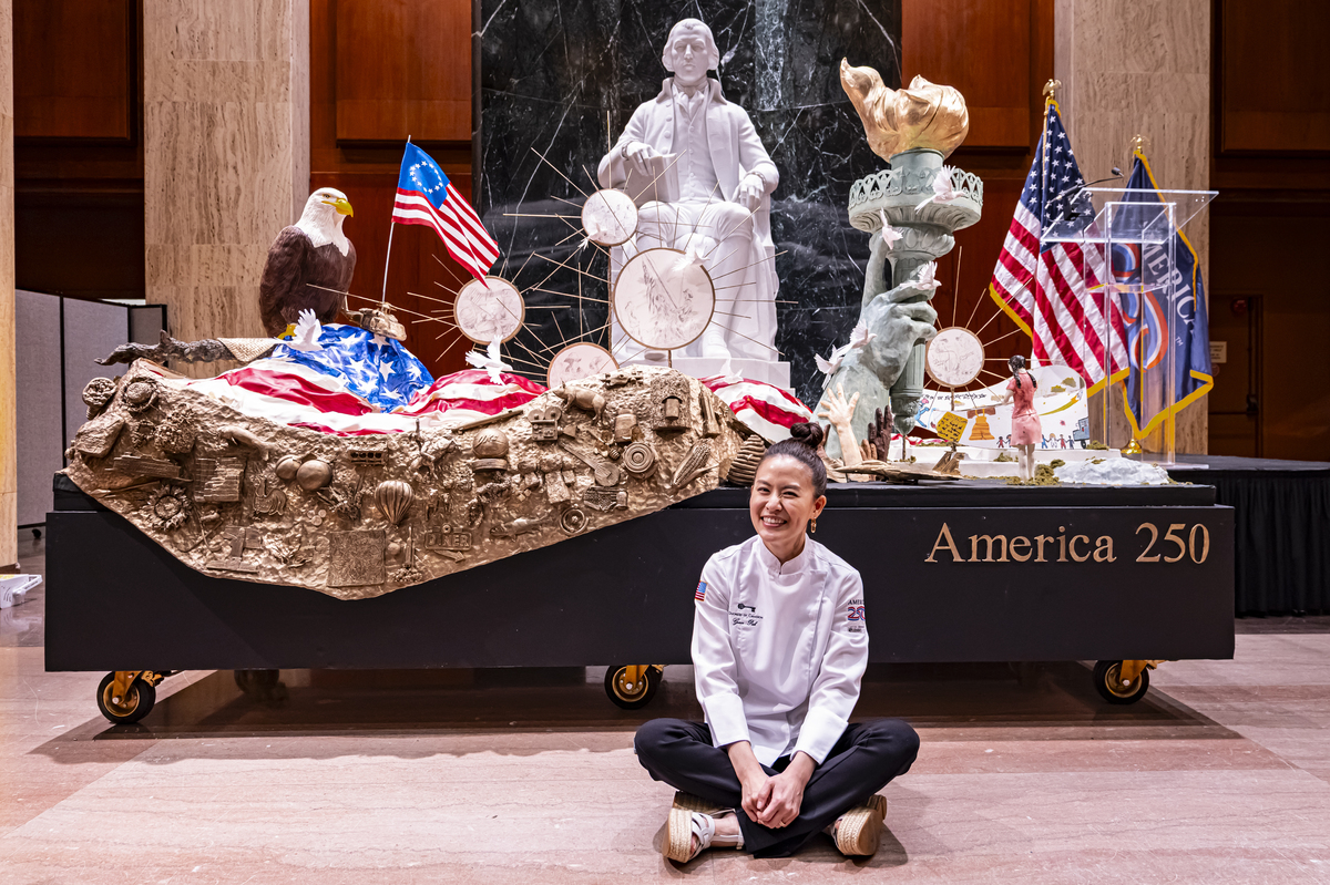 Chef Grace Pak with "America's birthday cake," at the Library of Congress in Washington, on Saturday, July 4, 2026. America celebrates the 250th anniversary of its independence today, with people from one end of the country to the other marking the milestone with fireworks, parades and concerts. (Scott Schuman/The New York Times)