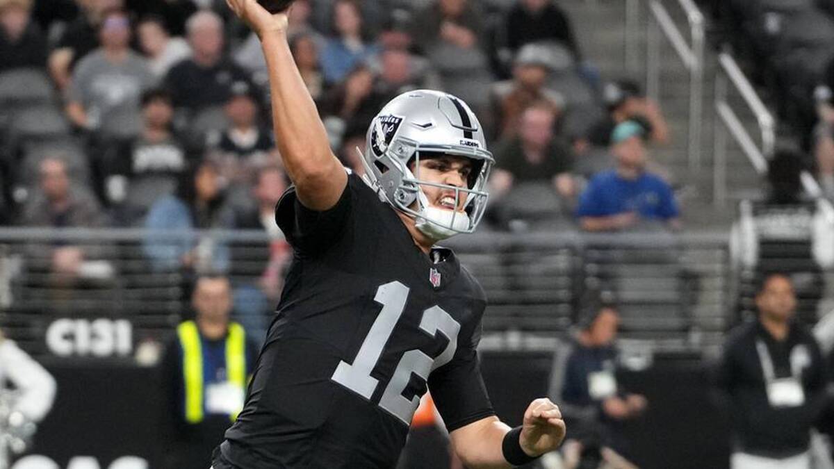  Jan 4, 2026; Paradise, Nevada, USA; Las Vegas Raiders quarterback Aidan O'Connell (12) throws the ball against Kansas City Chiefs defensive end Ashton Gillotte (97) in the fourth quarter at Allegiant Stadium. Mandatory Credit: Kirby Lee-Imagn Images | Kirby Lee-Imagn Images 