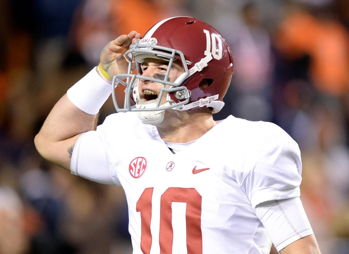  Alabama Crimson Tide quarterback AJ McCarron celebrates after a 99-yard touchdown against the Auburn Tigers at Jordan Hare Stadium. John David Mercer-USA TODAY Sports
