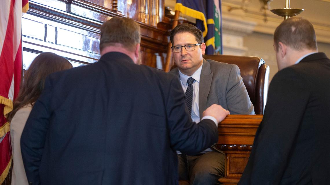 House Speaker Rep. Ron Ryckman, R-Olathe, talks with GOP house leaders following the vote to overturn Gov. Laura Kelly’s veto on a redistricting map Wednesday, Feb. 9, 2022. (Evert Nelson/The Topeka Capital-Journal via AP)