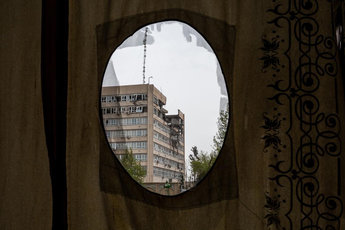 Damaged buildings seen through a curtain in Tehran, Iran, April 4, 2026. President Donald Trump said on Monday that a cease-fire proposal put forth by meditators between the United States and Iran was a "significant step," but he warned that it was "not good enough" as his deadline of Tuesday evening for a deal loomed. (Arash Khamooshi/The New York Times)