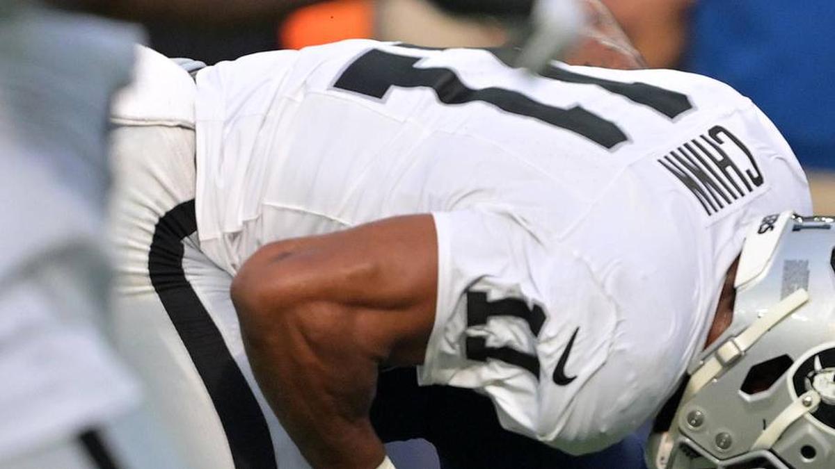  Nov 30, 2025; Inglewood, California, USA; Las Vegas Raiders safety Jeremy Chinn (11) tackles Los Angeles Chargers quarterback Justin Herbert (10) during the first half at SoFi Stadium. Mandatory Credit: Jayne Kamin-Oncea-Imagn Images | Jayne Kamin-Oncea-Imagn Images 