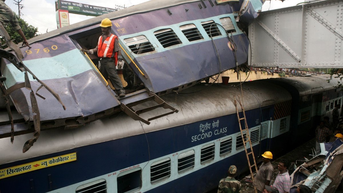 Members of the emergency services work at the site of a train accident near Sainthia station in India on July 19 2010. File Photo by Piyal Adhikary/EPA