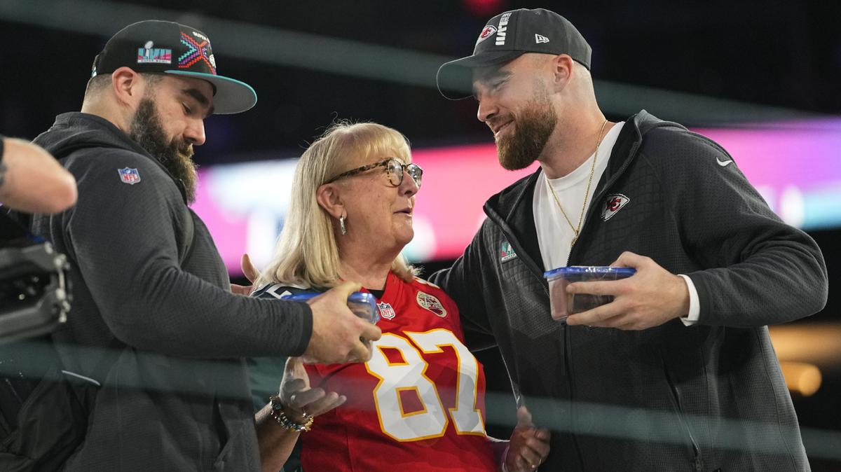 Mandatory Credit: Photo by Matt York/AP/Shutterstock (13757079bz) Donna Kelce greets her sons, Philadelphia Eagles center Jason Kelce, left, and Kansas City Chiefs tight end Travis Kelce during the NFL football Super Bowl 57 opening night, in Phoenix. The Kansas City Chiefs will play the Philadelphia Eagles on Sunday Super Bowl Football, Phoenix, United States - 06 Feb 2023