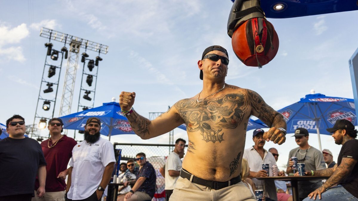 A fan of ultimate fighting hits a punching bag on the Ellipse outside of the White House ahead of the UFC Freedom 250 ceremonial weigh-ins in Washington, D.C., on Saturday. Photo by Jim Lo Scalzo/UPI