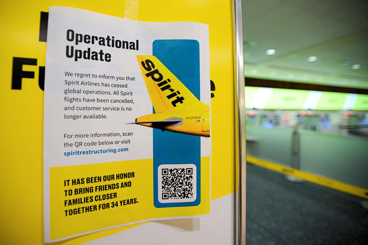 A Spirit Airlines operational update notice at Orlando International Airport, after Wall Street Journal reported that Spirit Airlines is preparing to cease operations around 3 a.m. on Saturday (0700 GMT), after hitting an impasse in talks with some creditors on a $500 million government bailout plan, in Orlando, Florida, U.S., May 2, 2026.  REUTERS/Miguel Rodriguez