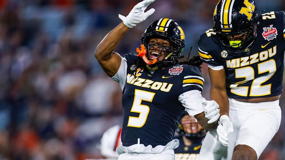  Missouri Tigers linebacker Khalil Jacobs (5) and Missouri Tigers linebacker Dante McClellan (22) celebrate a muffed punt during the second quarter of the TaxSlayer Gator Bowl at EverBank Stadium Saturday December 27, 2025 in Jacksonville, Fla. [Doug Engle/Florida Times-Union] | Doug Engle/Florida Times-Union / USA TODAY NETWORK via Imagn Images 