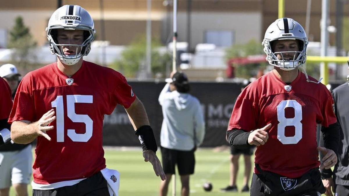  May 28, 2026; Henderson, NV, USA; Las Vegas Raiders quarterback Fernando Mendoza (15) and quarterback Kirk Cousins (8) warm up during organized team activities at Intermountain Health Performance Center. Mandatory Credit: Candice Ward-Imagn Images | Candice Ward-Imagn Images 