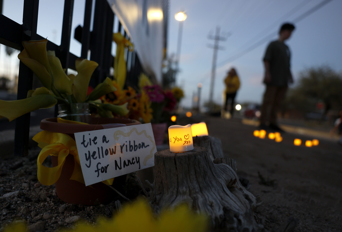  Yellow ribbons are placed at a memorial for Nancy Guthrie in front of the KVOA television station on March 1, 2026, in Tucson, Arizona. 