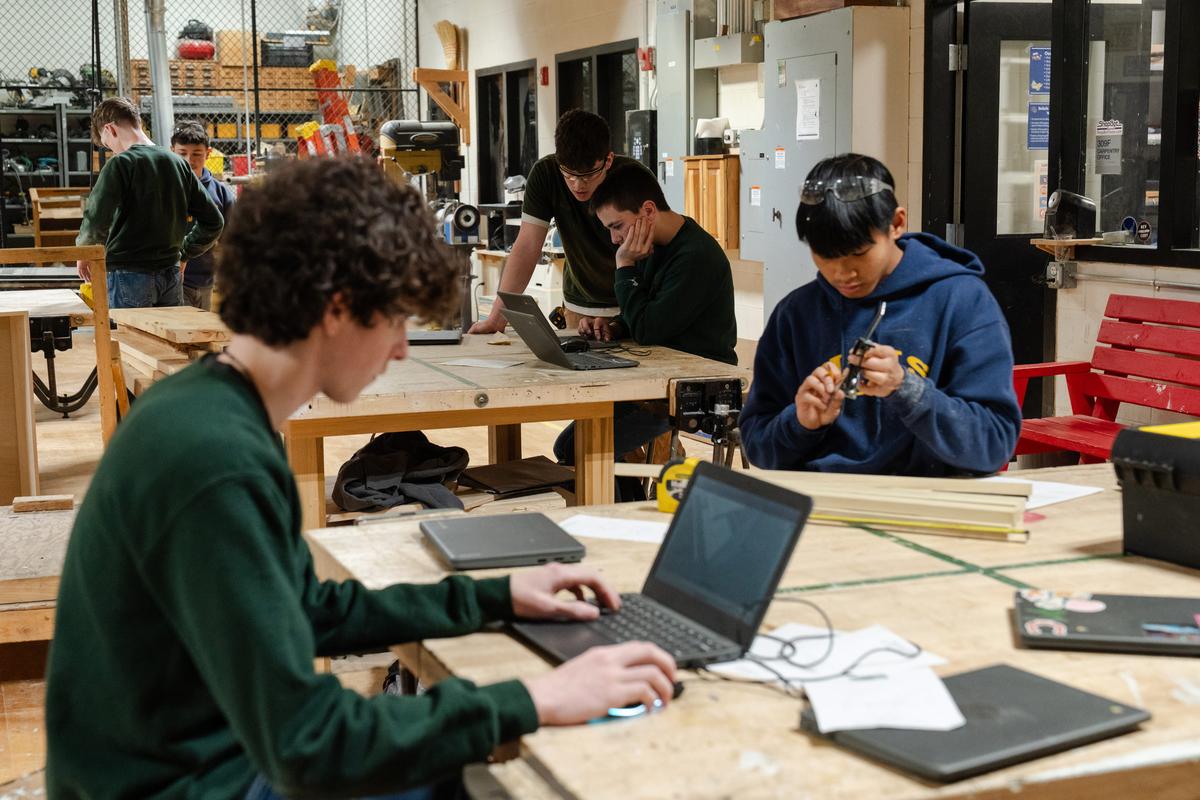 Carpentry students at work in their shop. Credit: Sophie Park for The Hechinger Report