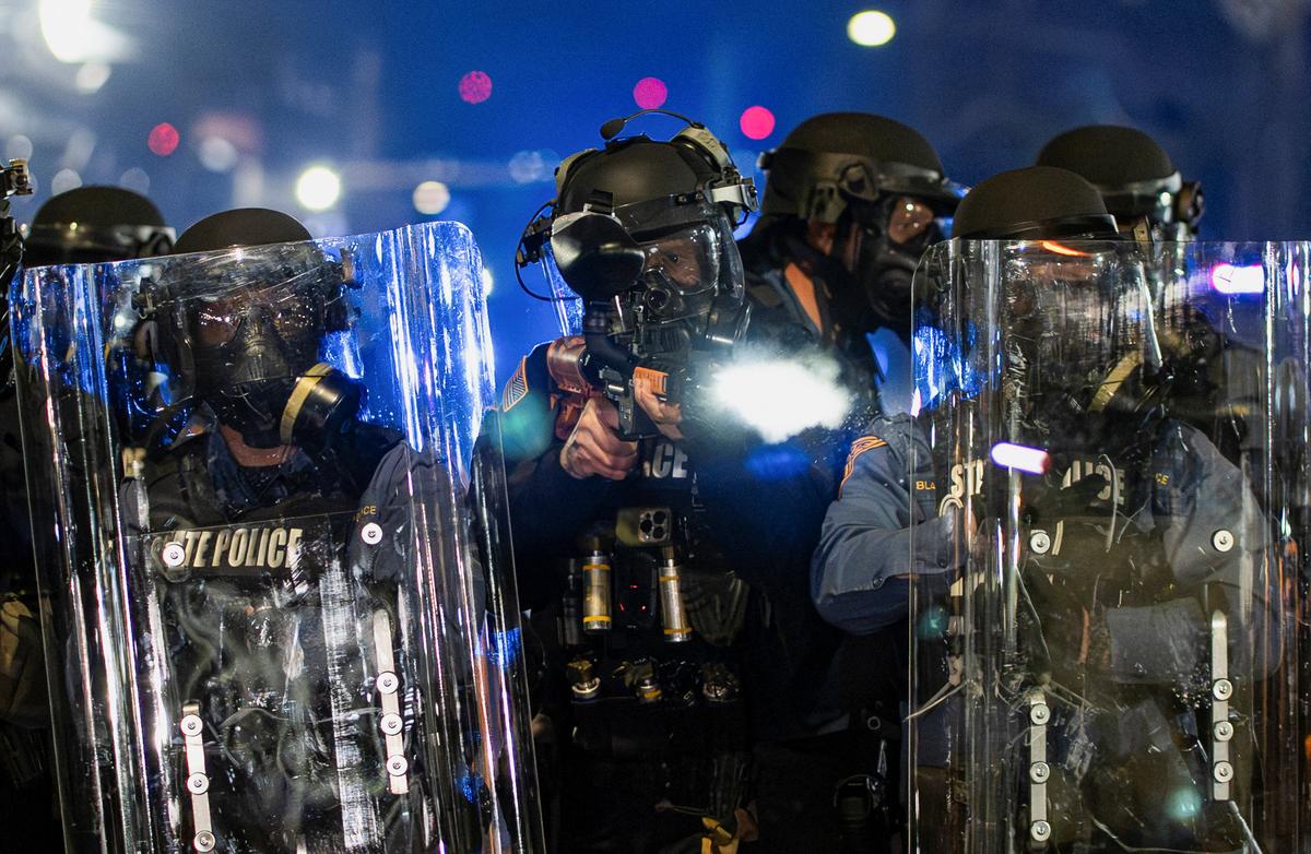 A New Jersey State Policeman fires a pepper ball bullet during a protest outside Delaney Hall detention centre in Newark, New Jersey, U.S., May 29, 2026. REUTERS/David 'Dee' Delgado