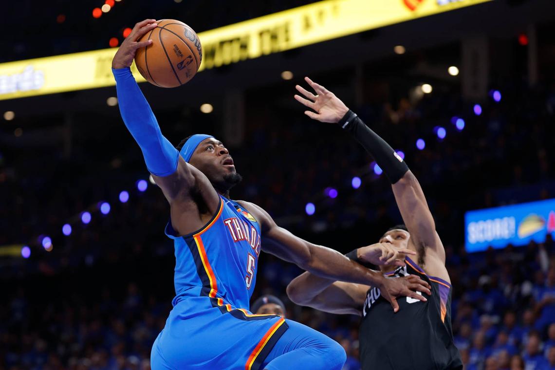  Apr 19, 2026; Oklahoma City, Oklahoma, USA; Oklahoma City Thunder guard Luguentz Dort (5) goes up for a basket beside beside Phoenix Suns forward Ryan Dunn (0) in the second half during game one of the first round of the 2026 NBA Playoffs at Paycom Center. Mandatory Credit: Alonzo Adams-Imagn Images 