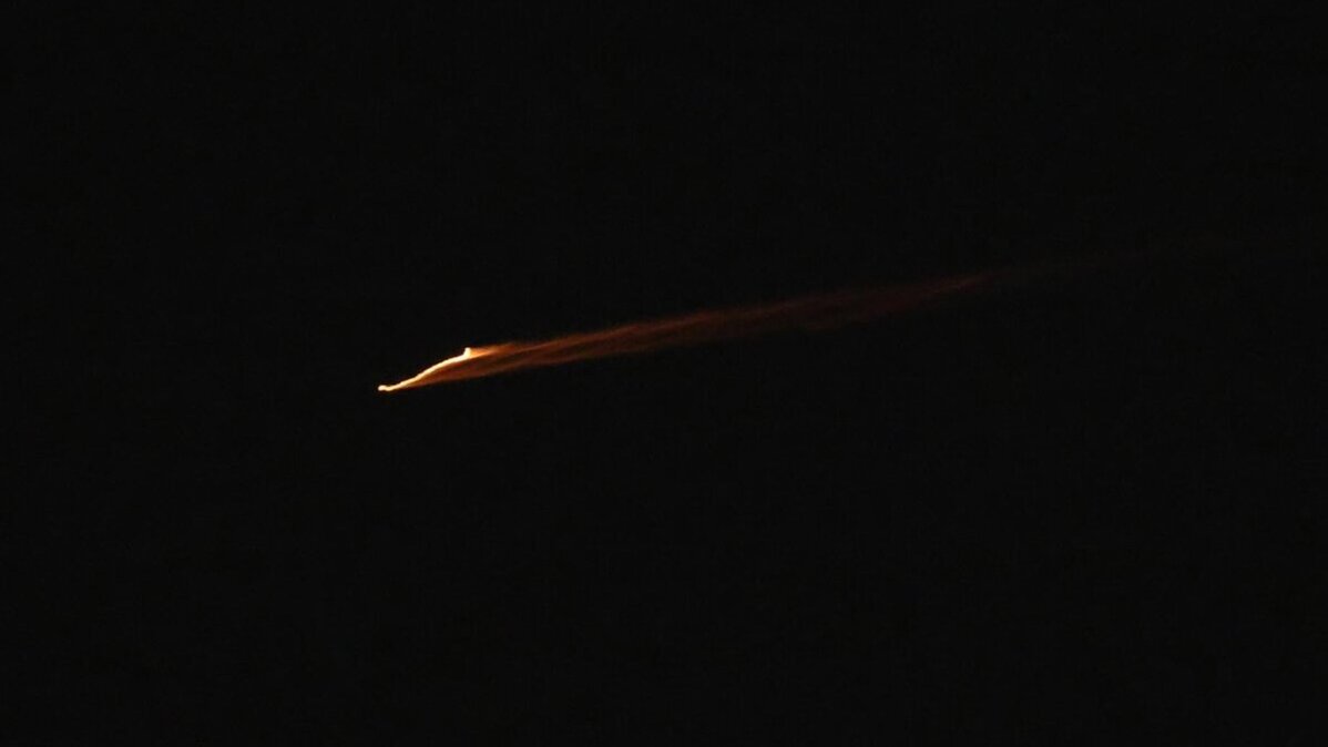 A projectile is pictured crossing the night sky over the West Bank city of Nablus early Sunday as Israel's military reported that Iran launched salvos of ballistic missiles toward Israel over its strikes in Lebanon. Photo by Alaa Badarneh/EPA