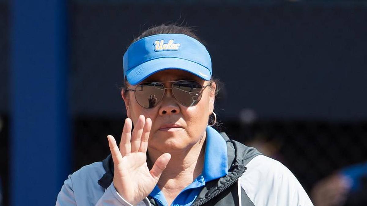  Jun 1, 2025; Oklahoma City, OK, USA; UCLA Bruins head coach Kelly Inouye-Perez holds her hand up in the sixth inning against the Tennessee Lady Volunteers during the NCAA Softball Women's College World Series at Devon Park. Mandatory Credit: Brett Rojo-Imagn Images | Brett Rojo-Imagn Images 