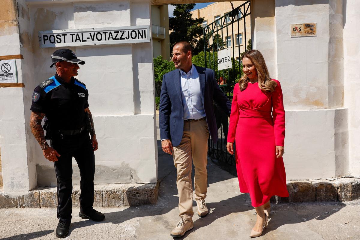 Malta's Prime Minister and Labour Party leader Robert Abela and his wife Lydia leave a polling station,  after voting during Malta's general election in Zejtun, Malta, May 30, 2026.  REUTERS/Darrin Zammit Lupi