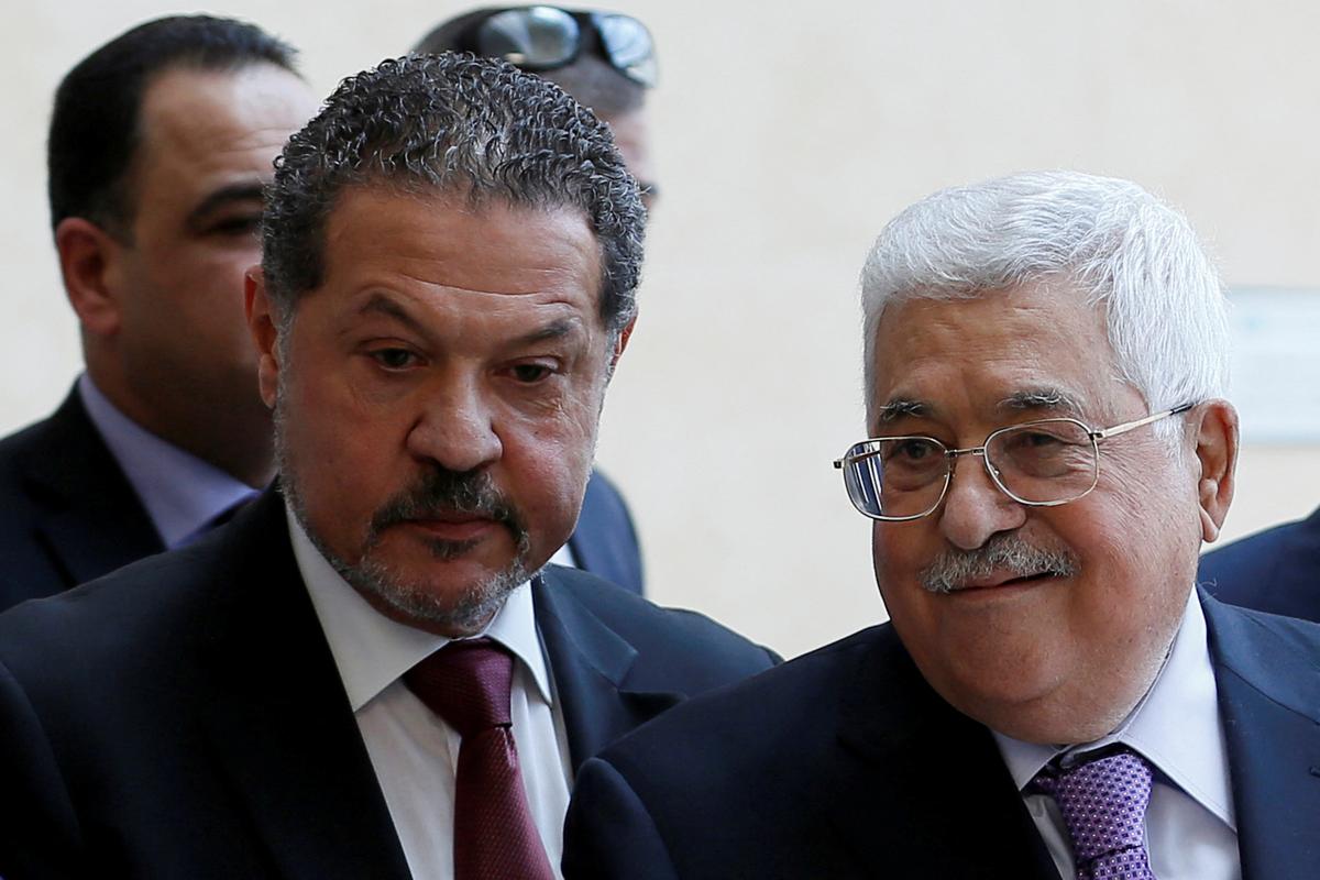 Palestinian President Mahmoud Abbas, accompanied by his son Yasser, leaves a hospital in Ramallah in the Israeli-occupied West Bank, May 28, 2018. REUTERS/Mohamad Torokman