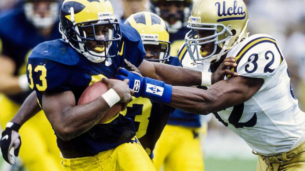  Sep 28, 1996; Ann Arbor, MI, USA; FILE PHOTO; Michigan Wolverines running back Clarence Williams (33) in action against UCLA Bruins defensive back Shaun Williams (32) at Michigan Stadium. Mandatory Credit: RVR Photos-USA TODAY Network | RVR Photos-Imagn Images 