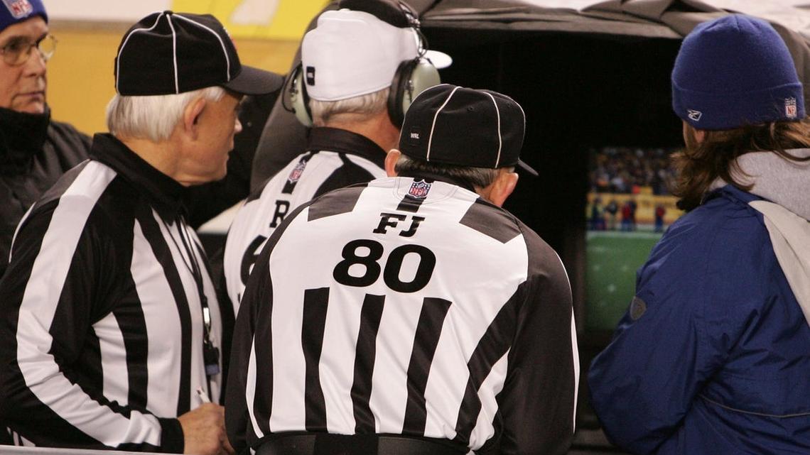 Replay officials throwing flags under consideration