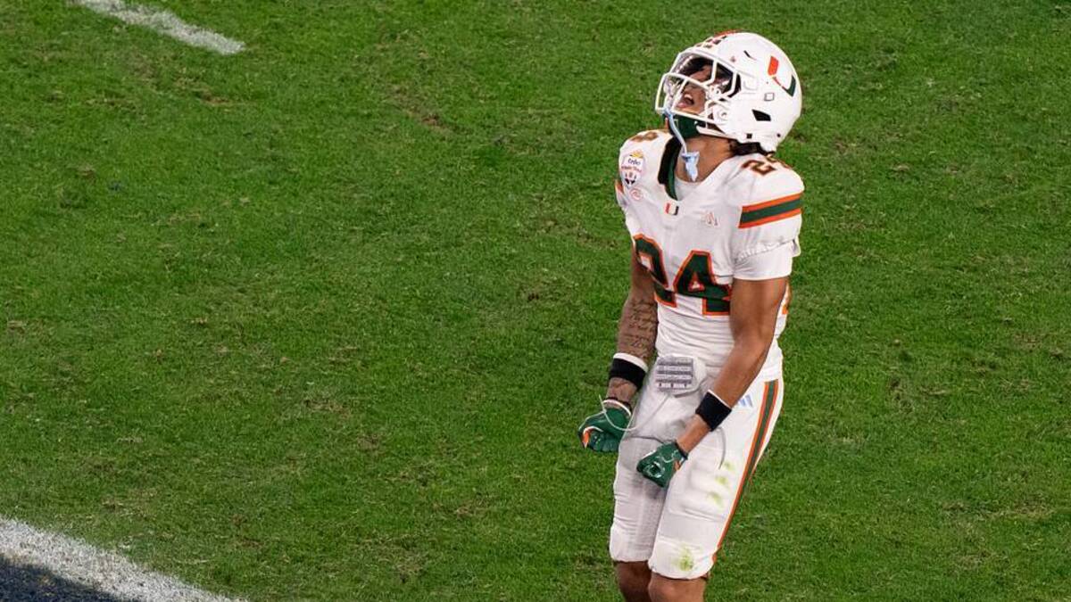  Miami Hurricanes defensive back Ethan O'Connor (24) gets frustrated after dropping an intercepted ball during the CFP Fiesta Bowl against Ole Miss at the State Farm Stadium, in Glendale, Ariz., on Thursday, Jan. 8, 2026. | Lauren Witte/Clarion Ledger / USA TODAY NETWORK via Imagn Images 